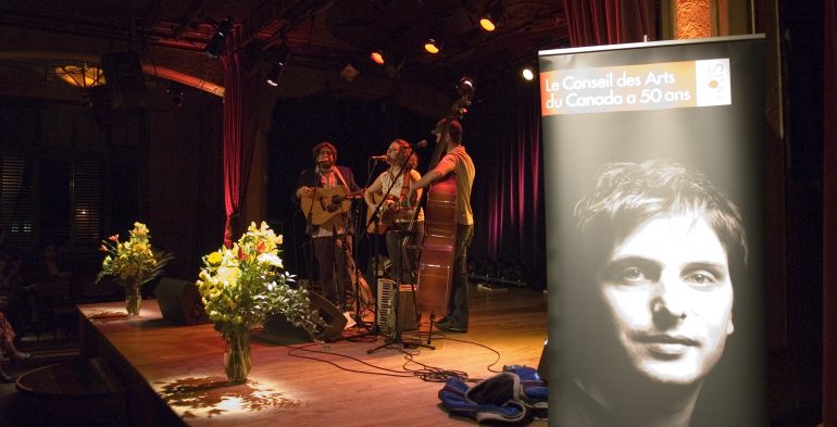 Trio playing music on stage