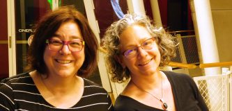 Two women smiling at the camera