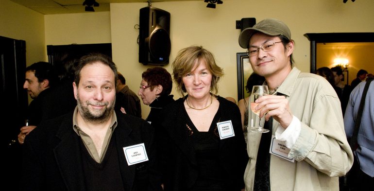 Folks drinking wine and smiling