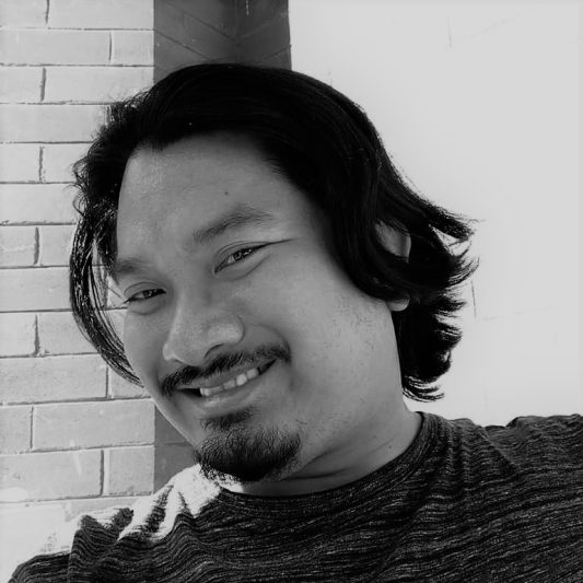 Black and white photo of Greg Santos